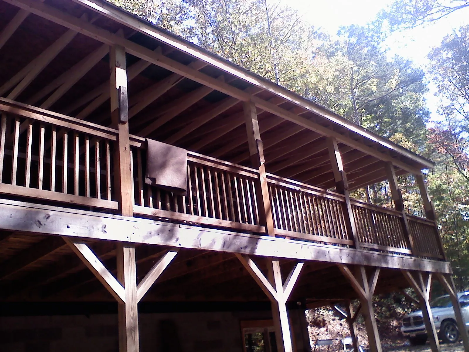 Timber framing under a new elevated porch and deck — Roof Leak Repair in Grand Prairie by Roofing Brothers